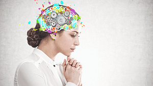 women in white shirt thinking, and image of brain in bright colours highlighted